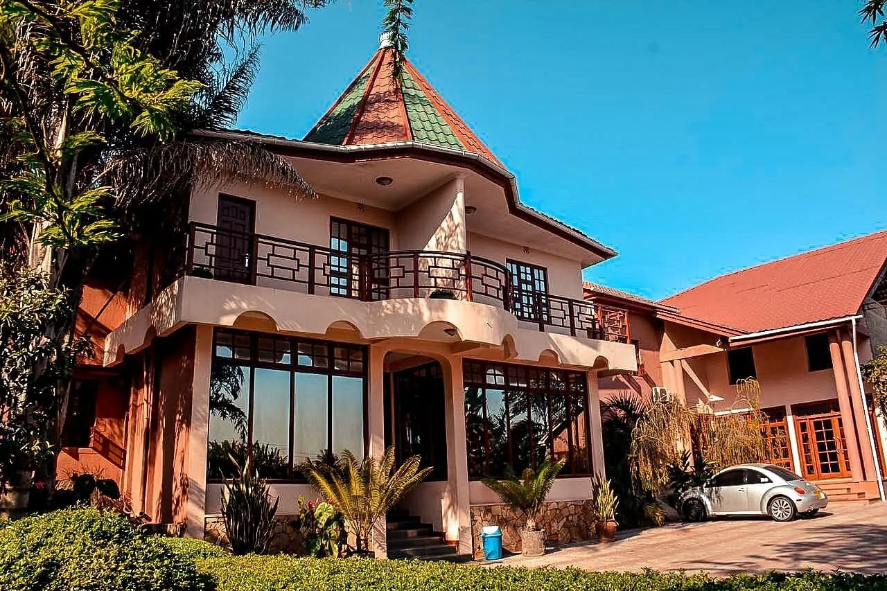 Garden-facing exterior of Charity Hotel in Arusha