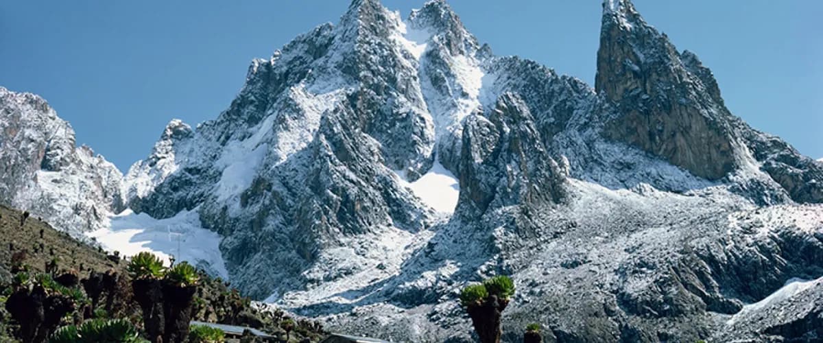 Snow-dusted rock faces of Mount Kenya