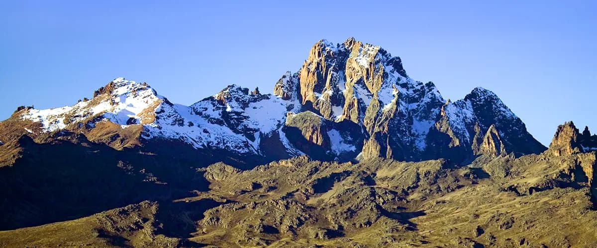 Sunlit snow and rock on Mount Kenya's summit ridge